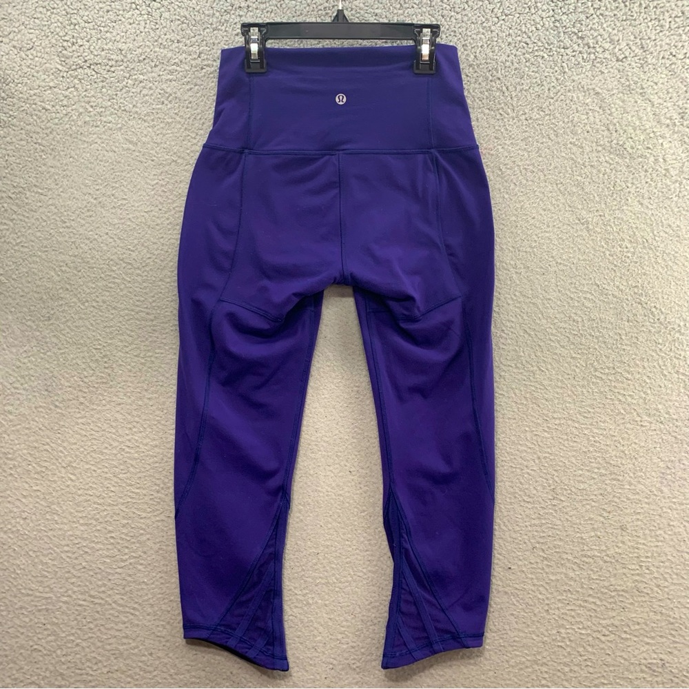 Lululemon Women’s Cropped Purple Asymmetrical Hem Capri Yoga leggings Size 6